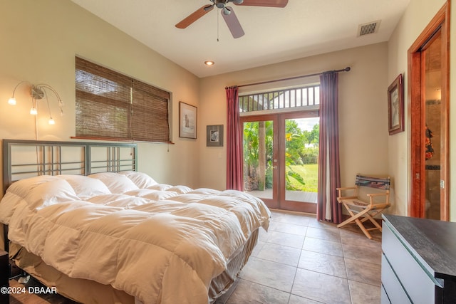 tiled bedroom featuring ceiling fan and french doors