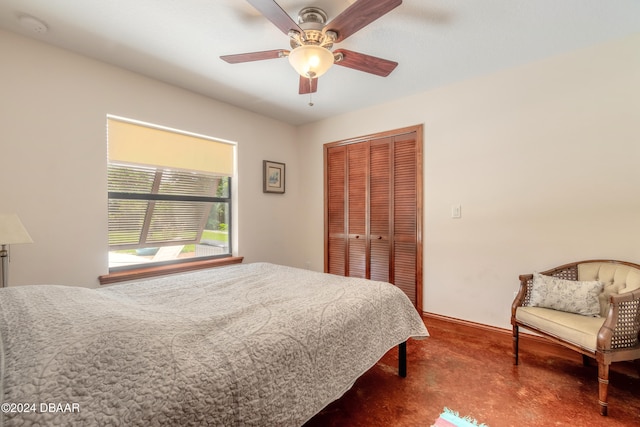 carpeted bedroom featuring a closet and ceiling fan