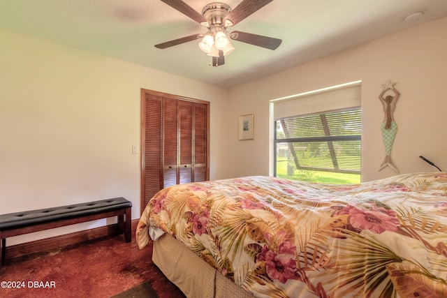 carpeted bedroom with a closet and ceiling fan