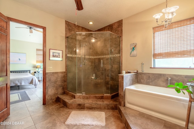 bathroom featuring separate shower and tub, a textured ceiling, tile patterned floors, and ceiling fan with notable chandelier