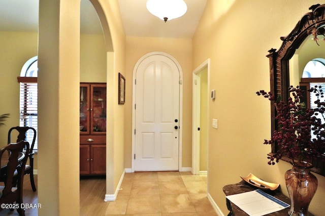 entryway with light tile patterned floors