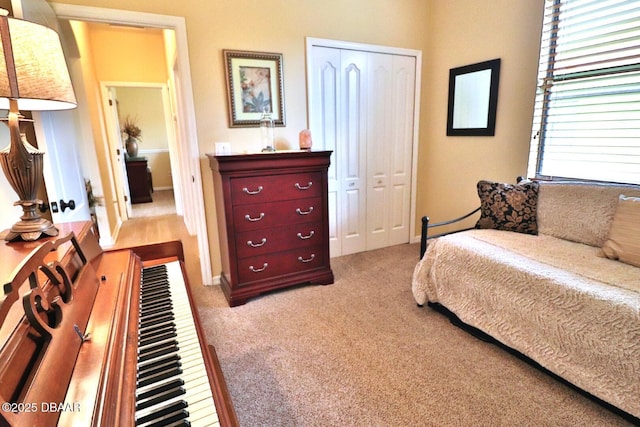 carpeted bedroom featuring a closet