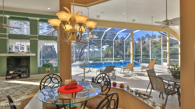 sunroom / solarium featuring ceiling fan