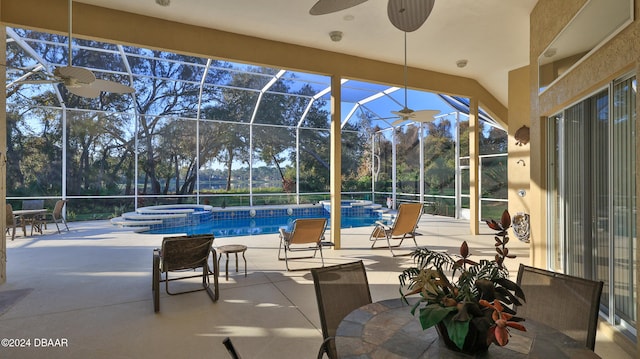 view of patio / terrace featuring a pool with hot tub, a lanai, and ceiling fan