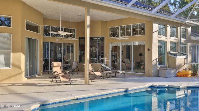 back of property featuring a patio area and a lanai