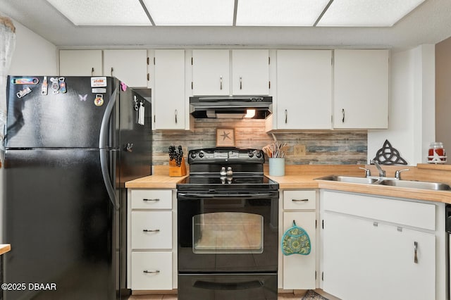 3333 S Ridgewood Ave Unit 8B, Port Orange, FL 32129 - kitchen featuring black appliances, range hood, tasteful backsplash, and white cabinetry