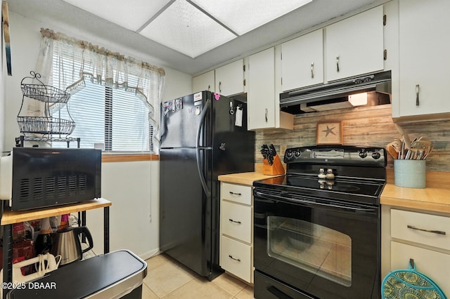3333 S Ridgewood Ave Unit 8B, Port Orange, FL 32129 - kitchen with black appliances, under cabinet range hood, light countertops, and backsplash