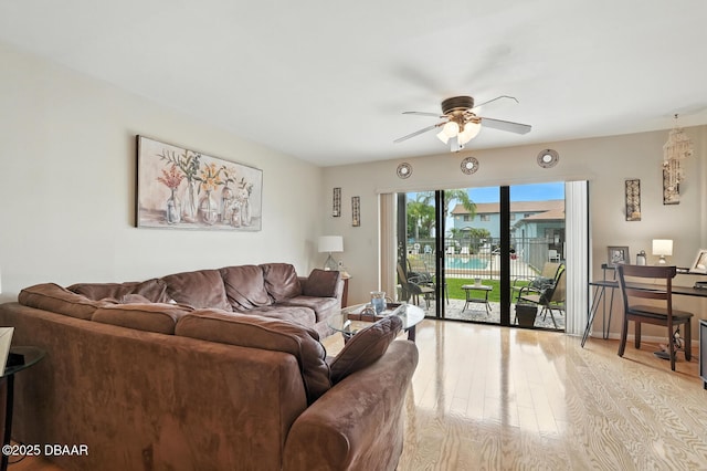 3333 S Ridgewood Ave Unit 8B, Port Orange, FL 32129 - living room featuring a ceiling fan and light wood-style floors
