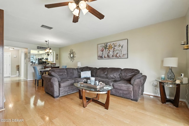 3333 S Ridgewood Ave Unit 8B, Port Orange, FL 32129 - living area with light wood-style flooring and a ceiling fan