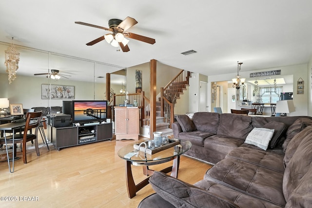3333 S Ridgewood Ave Unit 8B, Port Orange, FL 32129 - living area featuring ceiling fan, a chandelier, stairway, and wood finished floors