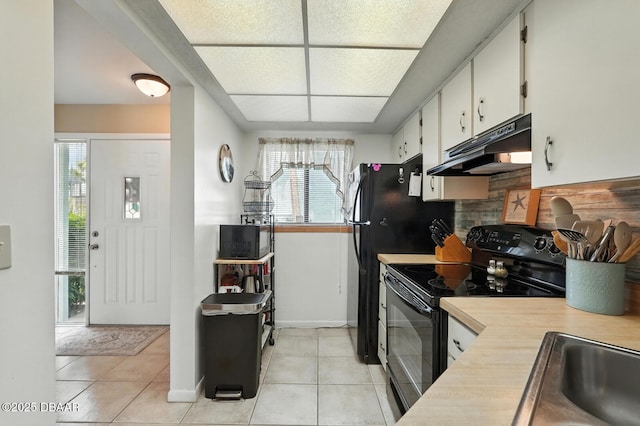 3333 S Ridgewood Ave Unit 8B, Port Orange, FL 32129 - kitchen featuring under cabinet range hood, black electric range, light countertops, and light tile patterned flooring