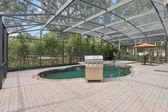 view of pool with a patio, glass enclosure, and an in ground hot tub