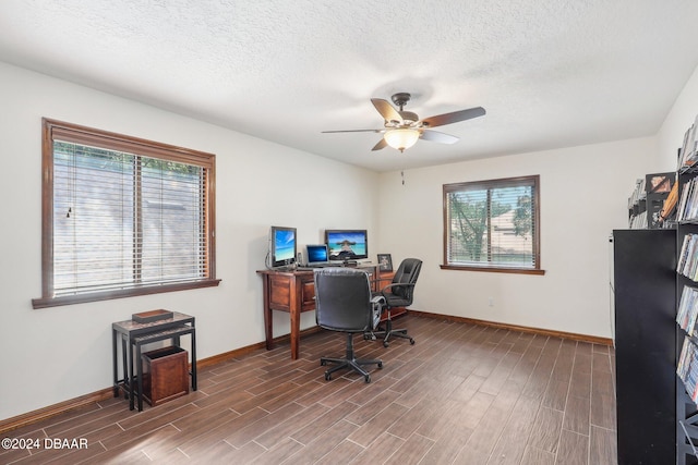 office with hardwood / wood-style floors, a healthy amount of sunlight, and a textured ceiling