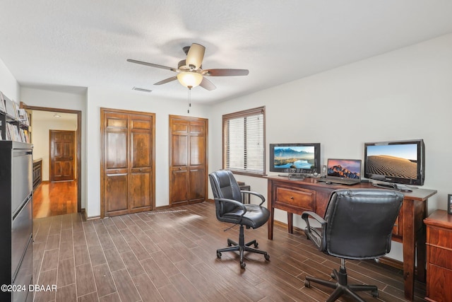 office area with a textured ceiling, hardwood / wood-style flooring, and ceiling fan