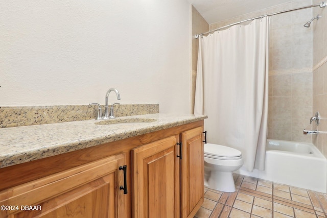 full bathroom featuring toilet, shower / bath combo, vanity, and tile patterned floors