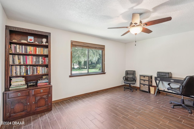 office with dark hardwood / wood-style flooring, a textured ceiling, and ceiling fan