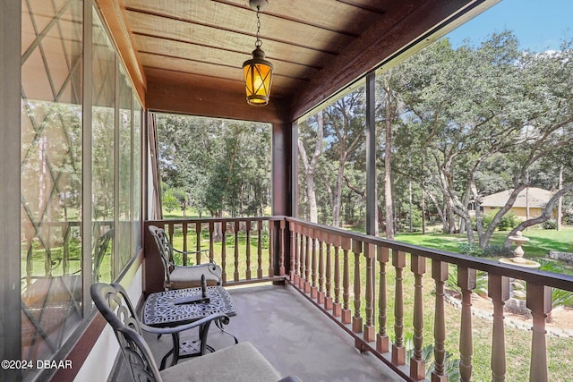 sunroom / solarium featuring wooden ceiling