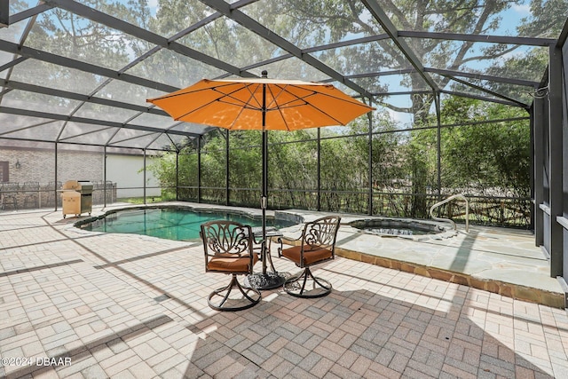 view of swimming pool with a lanai, a patio, and an in ground hot tub