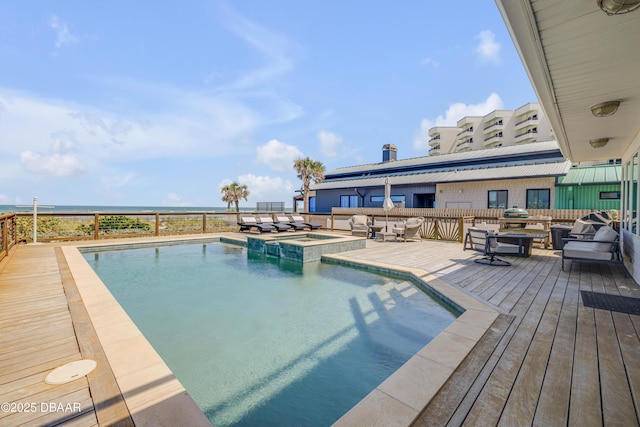 view of pool with a pool with connected hot tub, area for grilling, an outdoor living space, and a wooden deck