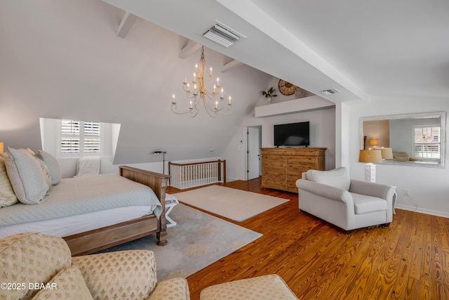 bedroom featuring wood finished floors, lofted ceiling with beams, a chandelier, and visible vents
