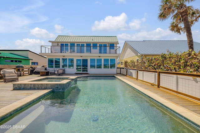 view of swimming pool featuring a pool with connected hot tub