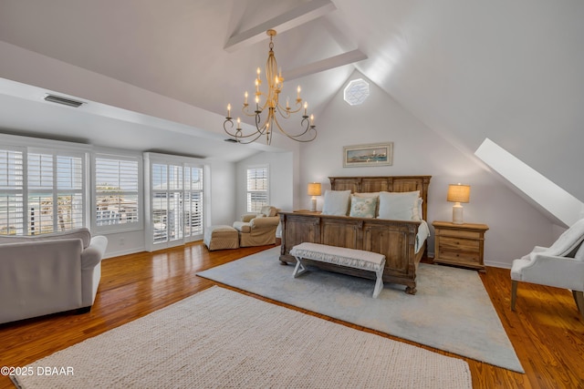 bedroom featuring visible vents, baseboards, wood finished floors, lofted ceiling, and a notable chandelier