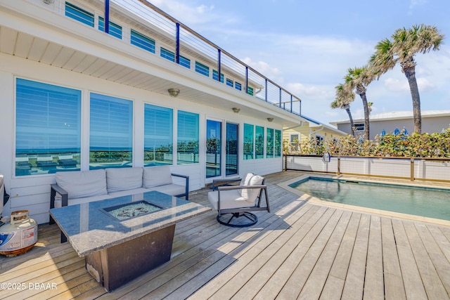 view of swimming pool featuring a fire pit