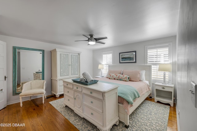 bedroom with ceiling fan and light wood-style flooring