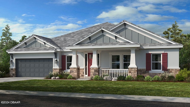 craftsman house with a front lawn, covered porch, and a garage