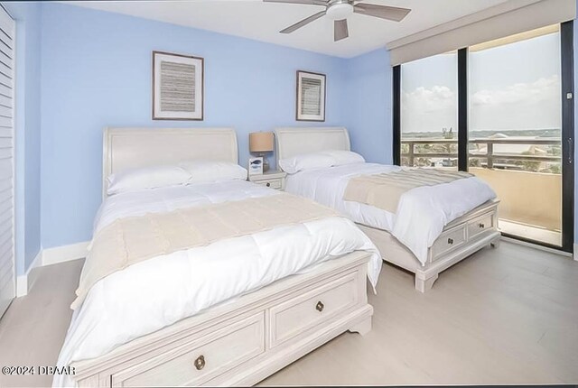 bedroom featuring light wood-type flooring and ceiling fan