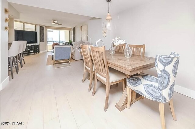 dining space featuring light hardwood / wood-style flooring