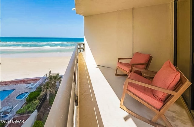 balcony with a view of the beach and a water view