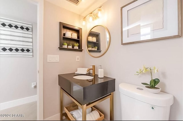 bathroom with toilet and sink