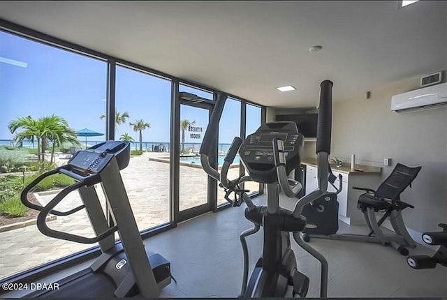 gym with a wall unit AC and a wall of windows