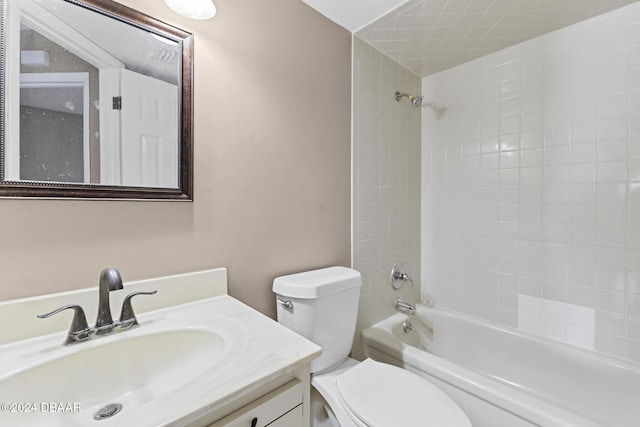 full bathroom with vanity, tiled shower / bath combo, and toilet