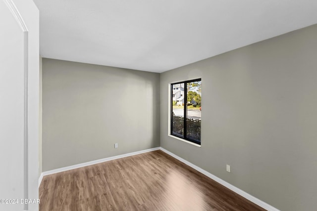 empty room with wood-type flooring