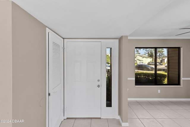 tiled foyer entrance featuring ceiling fan