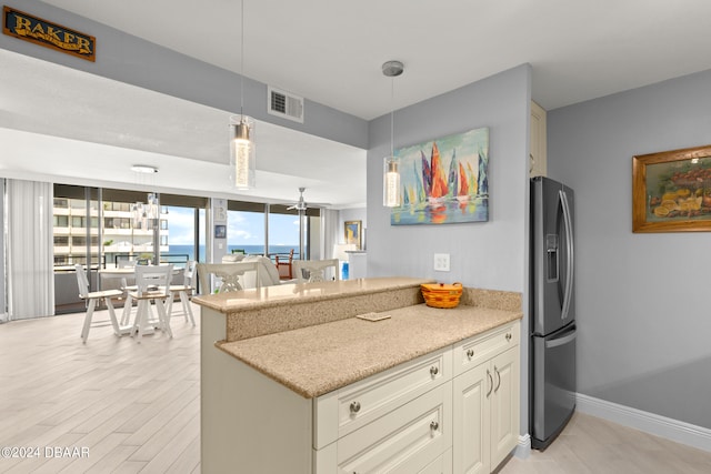 kitchen with stainless steel fridge with ice dispenser, hanging light fixtures, light hardwood / wood-style floors, kitchen peninsula, and ceiling fan