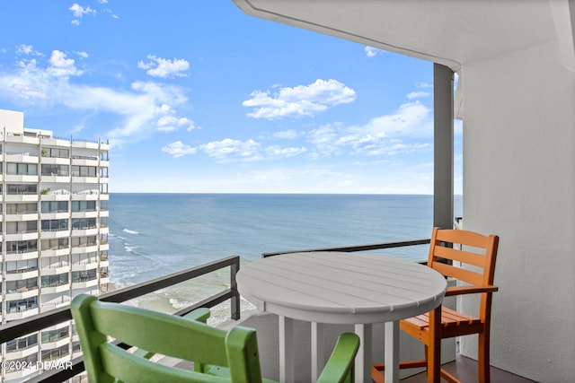 balcony featuring a water view