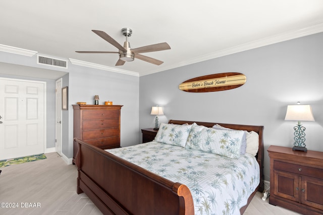 bedroom featuring ornamental molding, light hardwood / wood-style floors, and ceiling fan