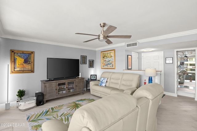 living room featuring ornamental molding, light hardwood / wood-style flooring, and ceiling fan