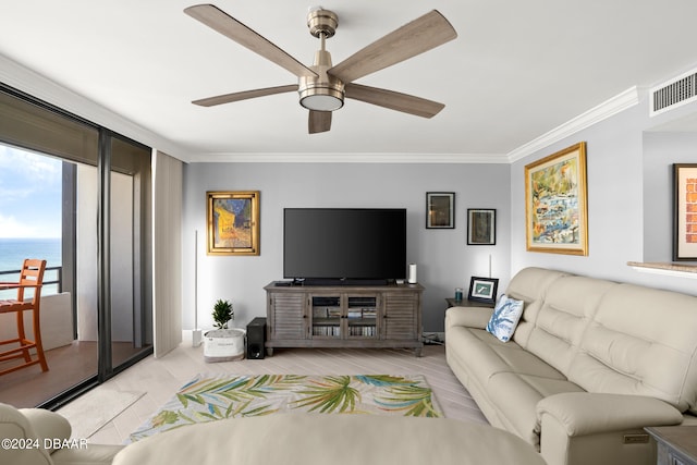 living room featuring light wood-type flooring, a water view, ceiling fan, and crown molding