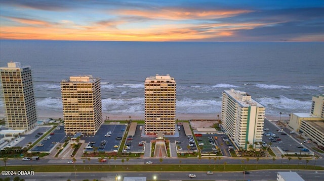 aerial view at dusk with a water view