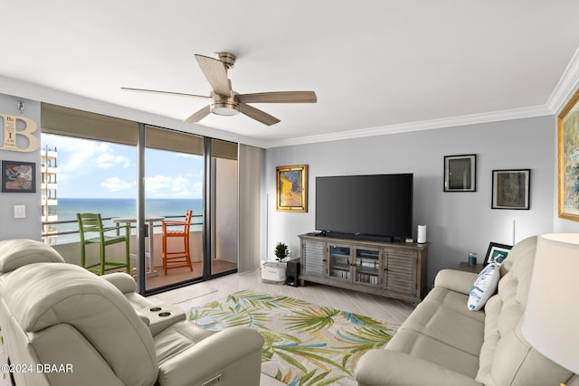 living room featuring a wall of windows, light hardwood / wood-style floors, ceiling fan, and crown molding