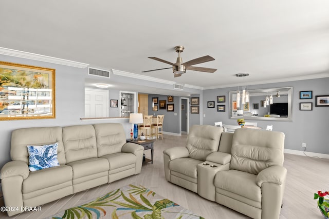 living room featuring light hardwood / wood-style floors, ceiling fan, and ornamental molding