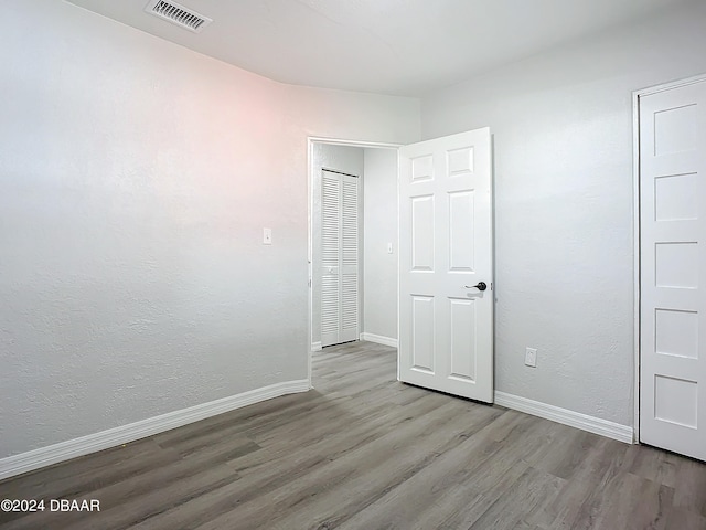 736 N Segrave St, Daytona Beach, FL 32114 - unfurnished bedroom with light hardwood / wood-style floors