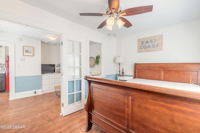 bedroom featuring a ceiling fan and light wood finished floors