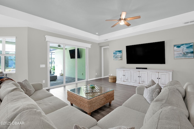 500 Barefoot Life Ln, Daytona Beach, FL 32124 - living area featuring ceiling fan, dark wood-type flooring, and a raised ceiling