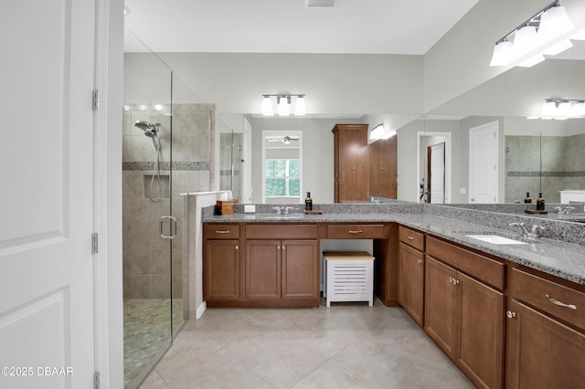 500 Barefoot Life Ln, Daytona Beach, FL 32124 - full bath featuring a shower stall, vanity, tile patterned flooring, and ceiling fan