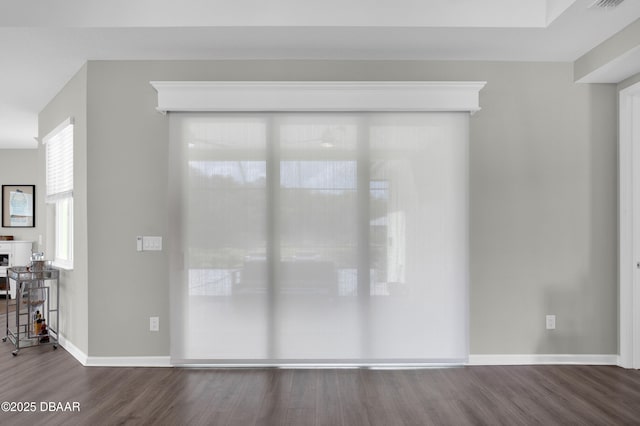 500 Barefoot Life Ln, Daytona Beach, FL 32124 - empty room featuring dark wood-style flooring and baseboards